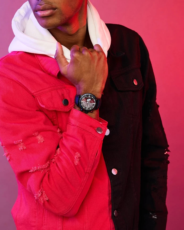 Citizen Spider-Man Double Vision CA0855-47W Eco-Drive chronograph worn on wrist with red and black streetwear styling, featuring the Spider-Man dial and blue strap.