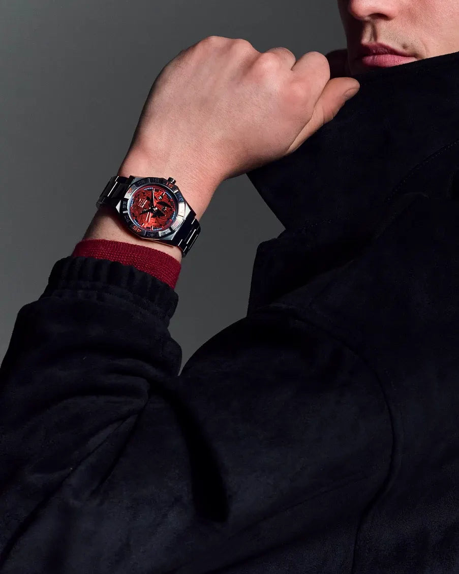 Citizen Star Wars Imperial Battle AW1857-57W Eco-Drive watch worn on wrist with dark outerwear styling, featuring the red Death Star dial, angular gray case, and stainless steel bracelet.