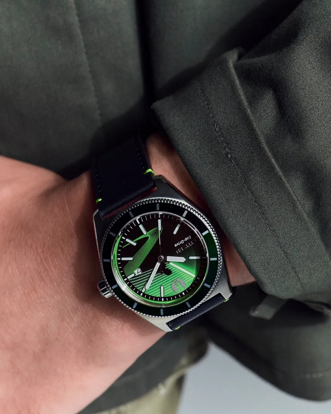 Citizen Star Wars Luke Skywalker AW1910-48W worn on wrist with dark green styling, featuring the black and green dial, luminous lightsaber motif, silver-tone case, and black leather strap.