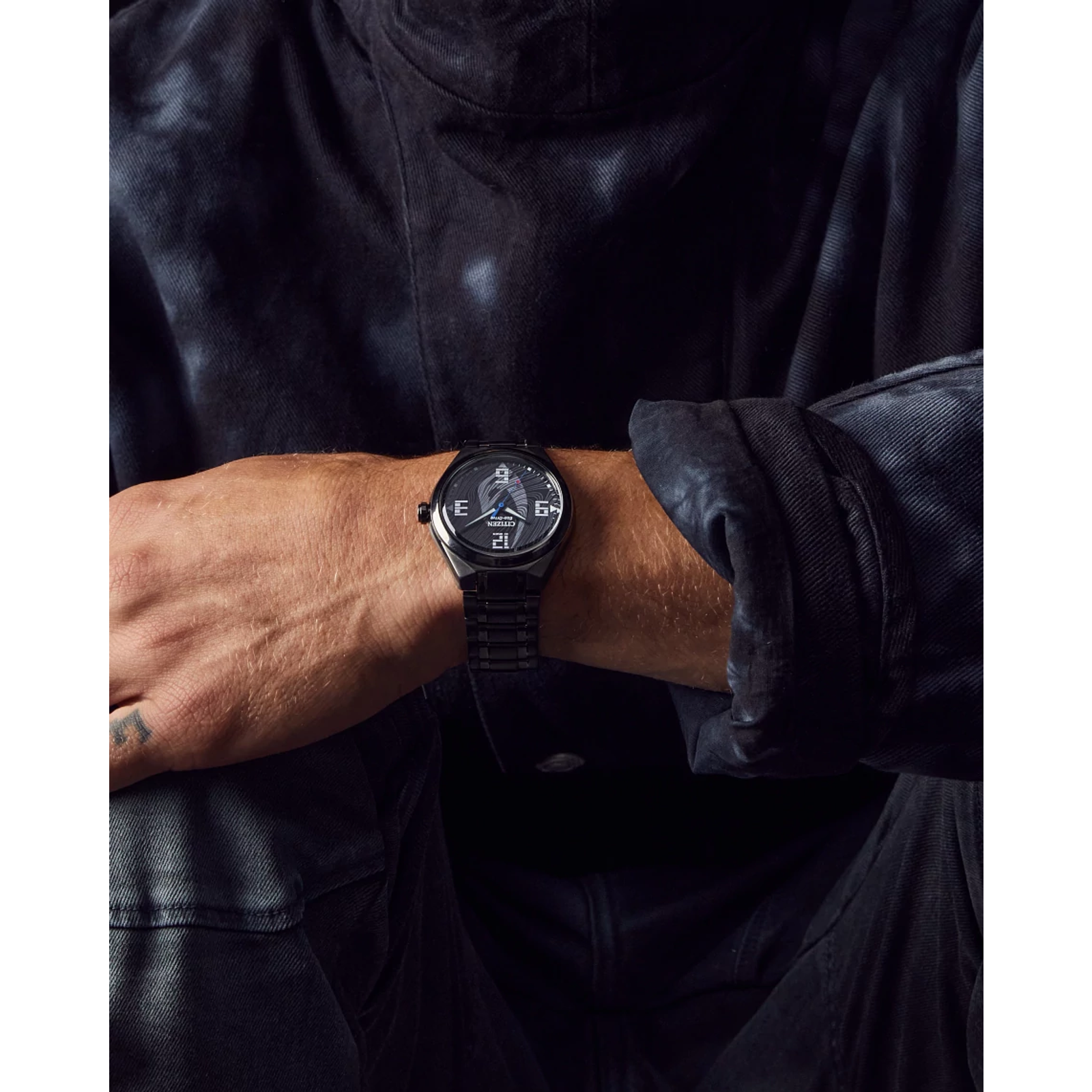 CITIZEN Star Wars Mandalorian AW2045-57W – matte black Eco-Drive watch with Mudhorn signet dial, etched helmet case back, Beskar-inspired bracelet, and WR100 water resistance.