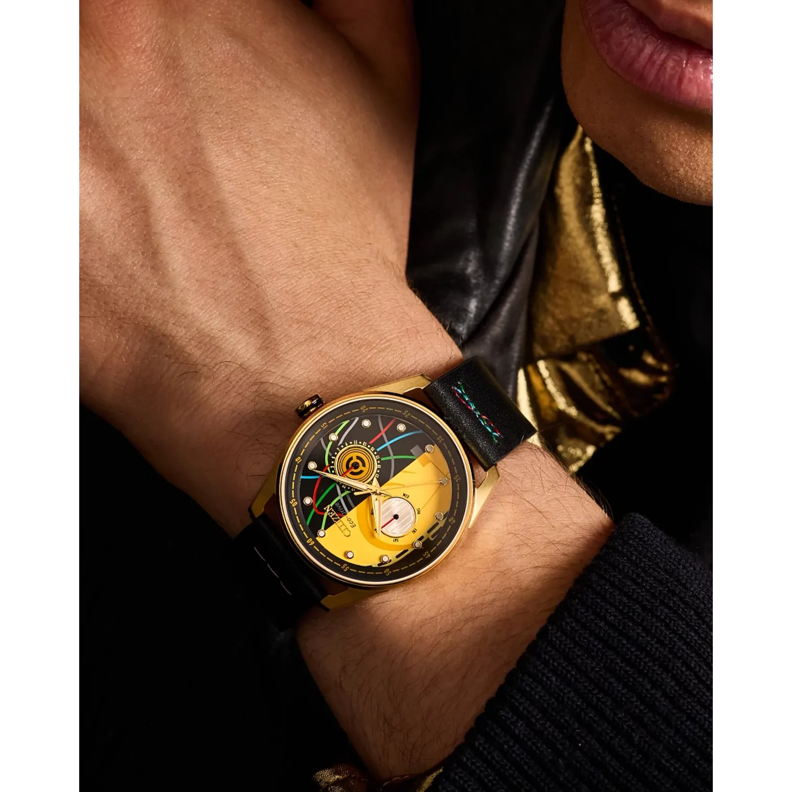 CITIZEN Star Wars C-3PO Rewired BU4026-05W – gold-tone Eco-Drive watch with yellow dial, C-3PO-inspired details, black leather strap with colorful stitching, and WR100 water resistance.