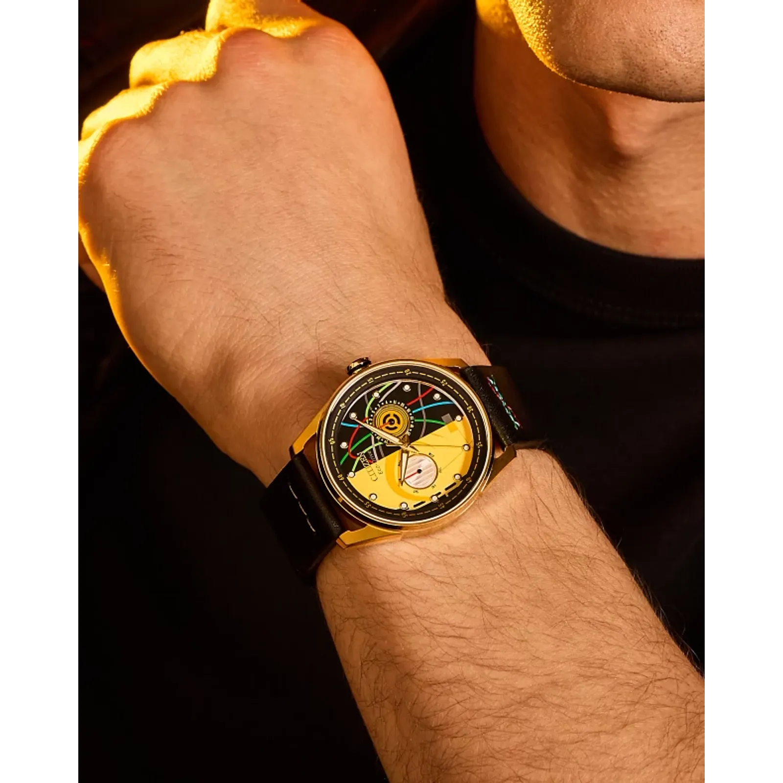 CITIZEN Star Wars C-3PO Rewired BU4026-05W – gold-tone Eco-Drive watch with yellow dial, C-3PO-inspired details, black leather strap with colorful stitching, and WR100 water resistance.