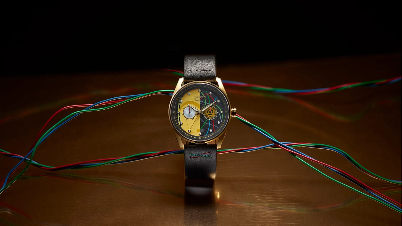 CITIZEN Star Wars C-3PO Rewired BU4026-05W – gold-tone Eco-Drive watch with yellow dial, C-3PO-inspired details, black leather strap with colorful stitching, and WR100 water resistance.