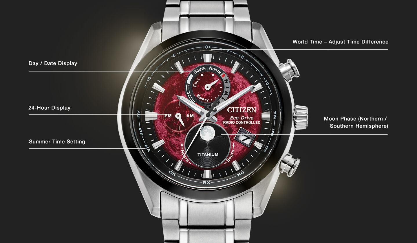 Citizen watch with red face and silver band on a black background