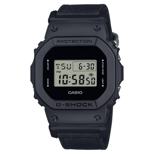 G-SHOCK DW5600BCE-1 digital watch with an all-black square 5600 design, CORDURA® Eco Fabric cloth band, shock-resistant construction, and classic G-SHOCK durability.