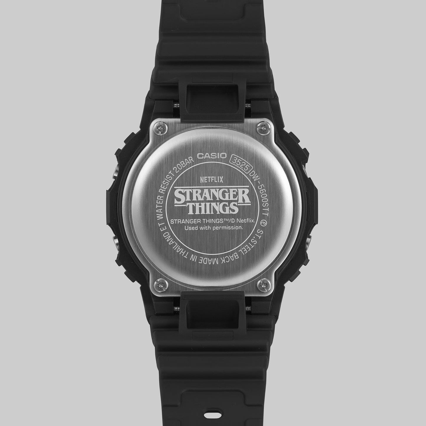 G-SHOCK DW5600STT-1 Stranger Things collaboration featuring vine-pattern dial inspired by Vecna, upside-down ‘A’ detail, red LED backlight, ‘011’ band loop tribute, bio-based black resin case and band, and special Demogorgon-themed packaging.”
