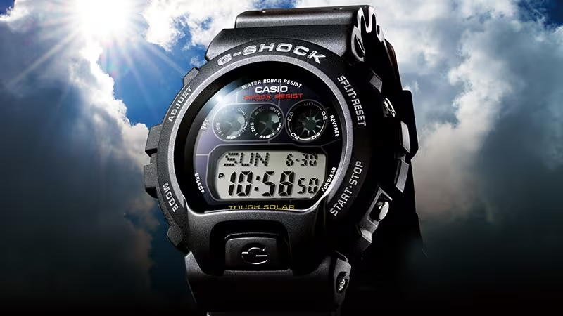 Casio G-Shock watch against a dramatic sky background