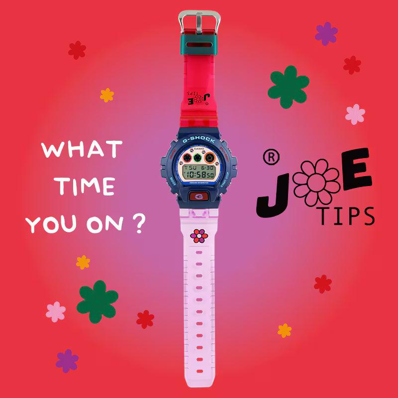 Colorful digital watch with floral designs and text on a red background