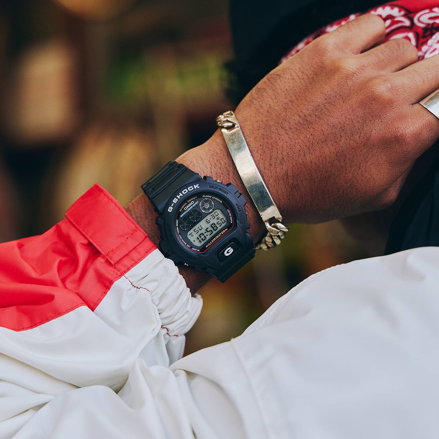 Person wearing a Casio G-Shock watch on a blurred background