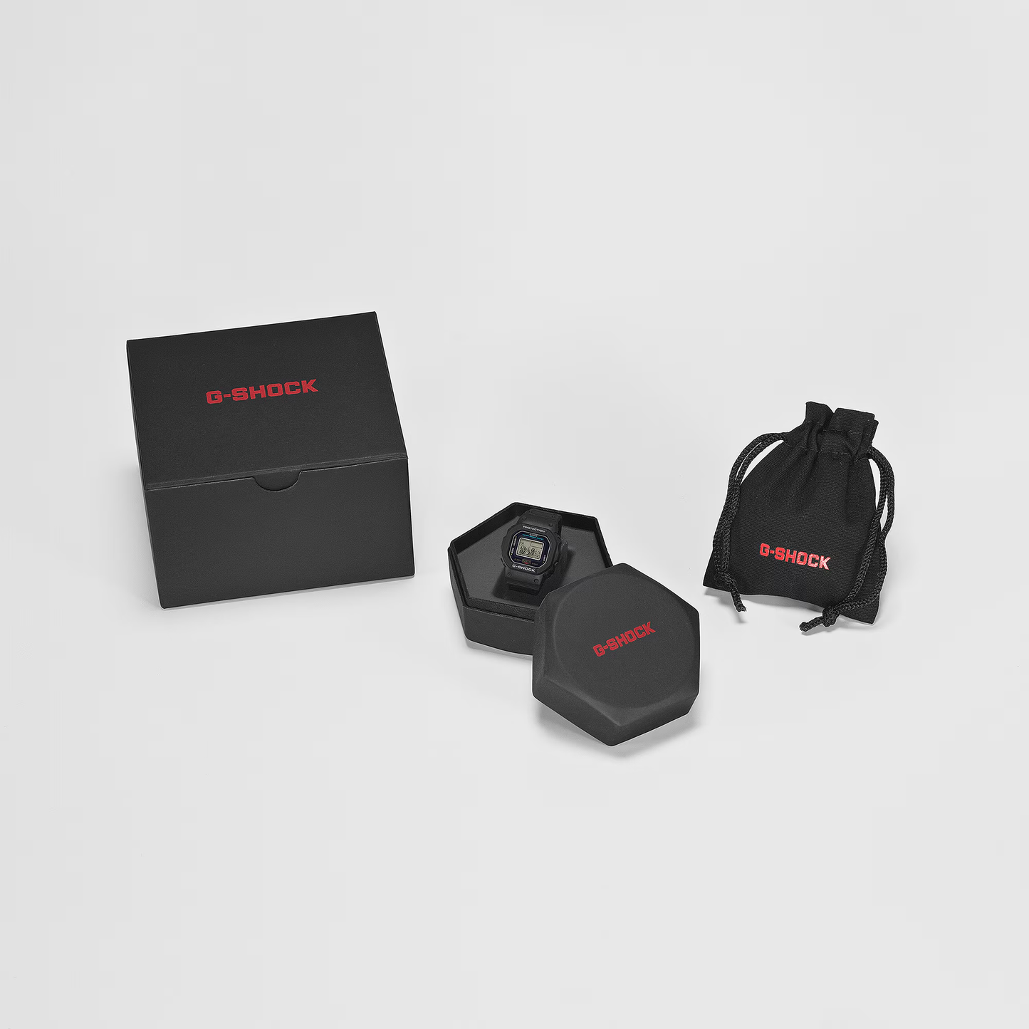 G-Shock watch set with packaging on a light gray background