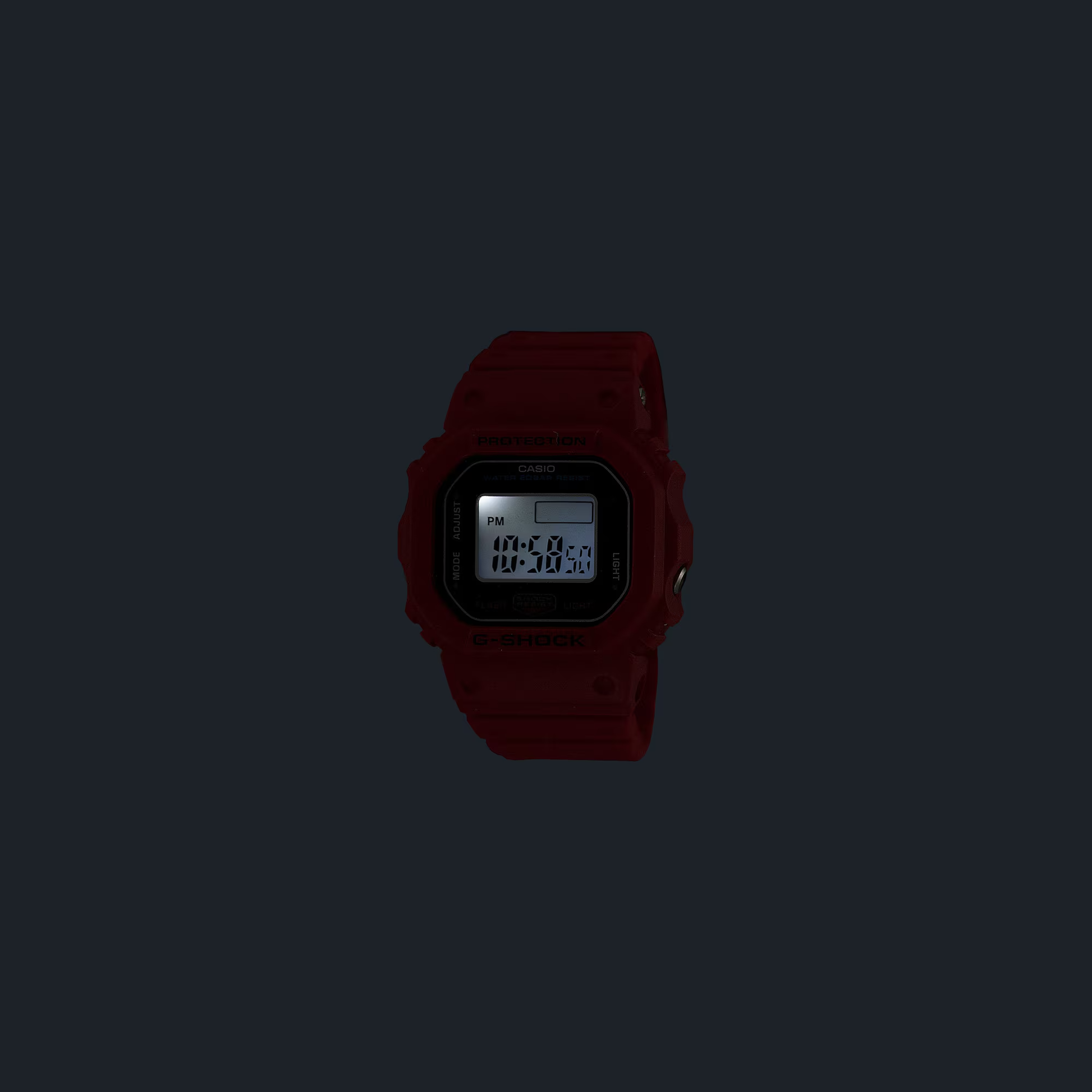 Casio G-SHOCK Nano DWN5600-4 miniature watch. 1/10-scale red version of the DW-5600 made from sustainable bio-based resin. Features 23.4 × 20 × 7.5 mm case, 6 g weight, LED backlight with time flash, dual time, stopwatch, and auto-calendar. Shock resistant and 200-meter water resistant. Includes special silicone display stand and approx. 2-year SR621SW battery