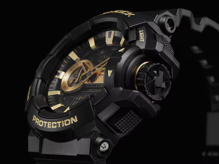 Black and gold watch with 'Protection' text on a dark background