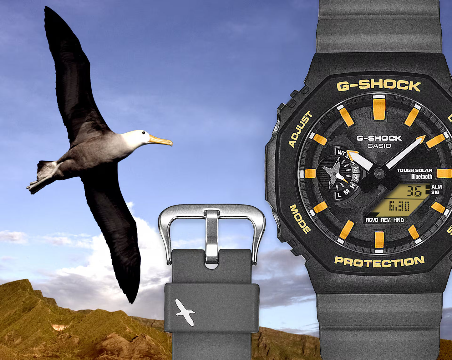 G-Shock watch with black strap and yellow accents against a mountain and bird background