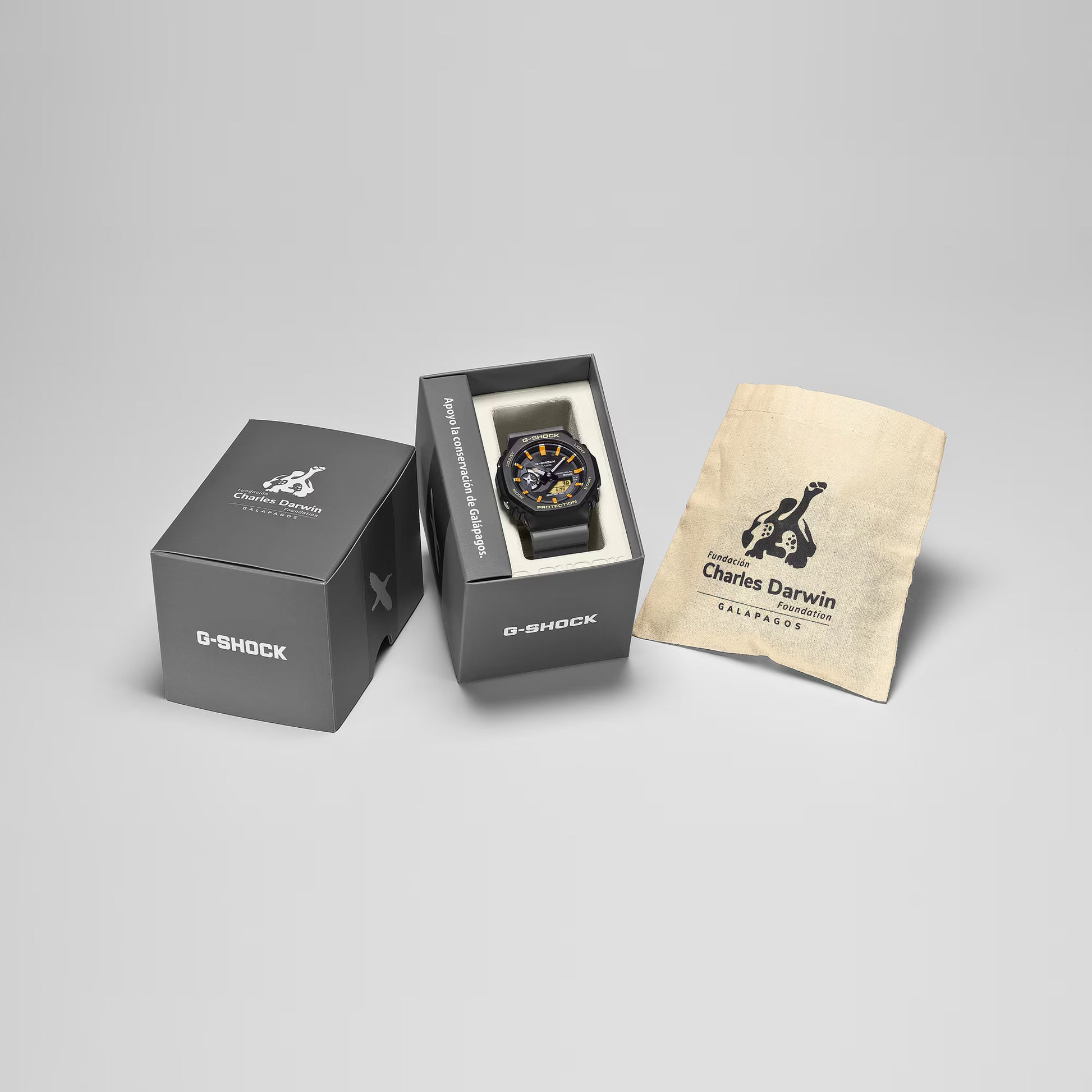 G-Shock watch in a box with a Charles Darwin label on a gray background