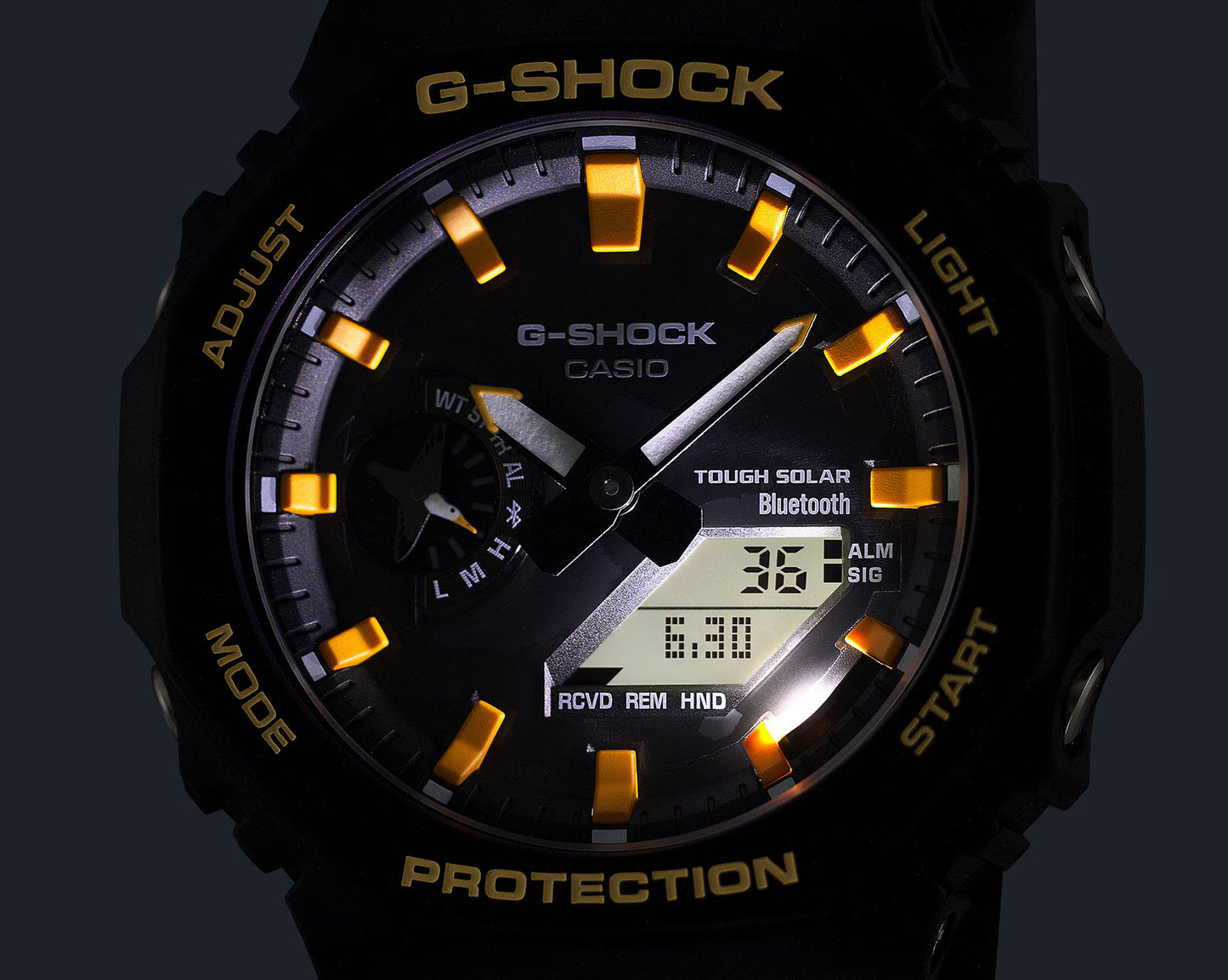 G-Shock Casio watch with black and gold design on a dark background