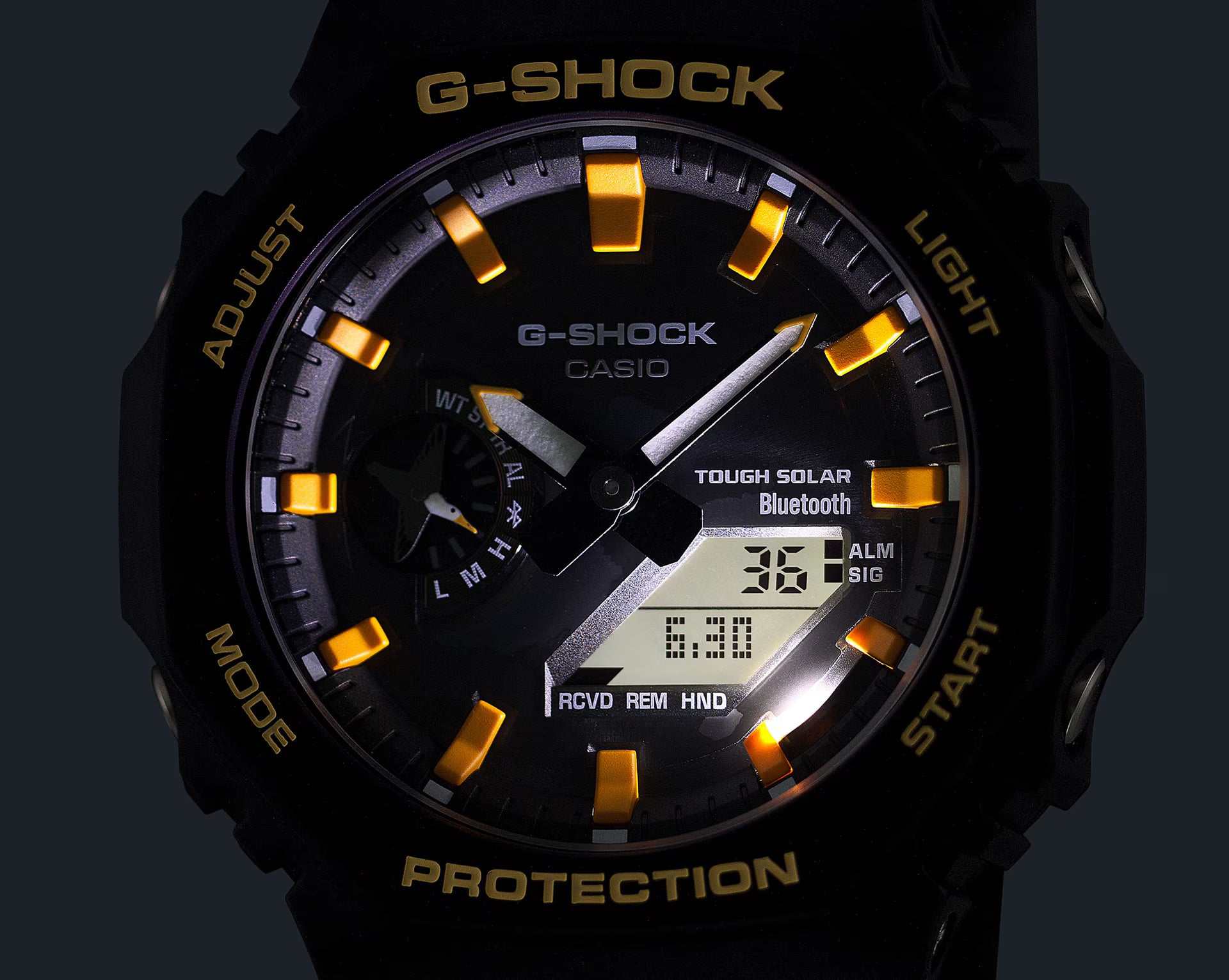 G-Shock Casio watch with black and gold design on a dark background
