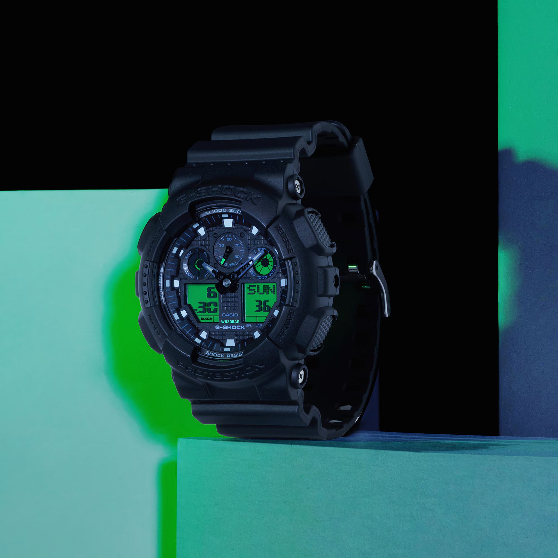 Black digital watch on a green and blue gradient background