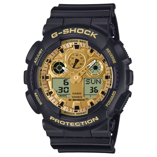 Casio G-SHOCK GA100GGB-1A9 watch with oversized 55 × 51.2 × 16.9 mm resin case, black-and-gold vapor deposition finish, and gold mirror LCD. Features shock resistance, magnetic resistance, 200-meter water resistance, and mineral glass. Functions include 1/1000-second stopwatch with speed/distance measurement, countdown timer, world time (29 zones, 48 cities + UTC), 5 daily alarms with snooze, hourly signal, full auto-calendar, and 12/24-hour display. Amber LED backlight with selectable duration. Powered by 