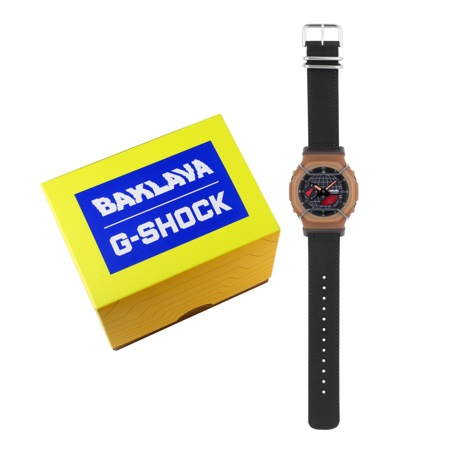 Watch with black strap and wooden case next to a yellow box with 'BAKLAVA G-SHOCK' branding.