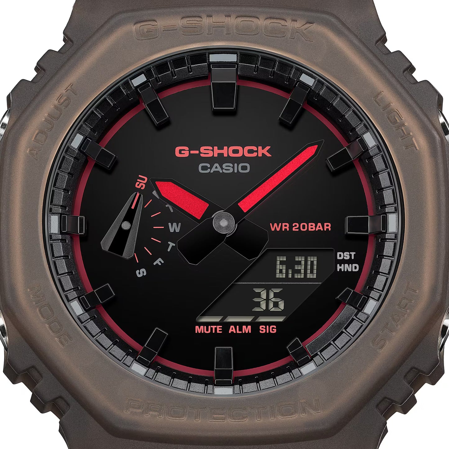 G-Shock Casio watch with brown casing and black face displaying digital and analog readings.