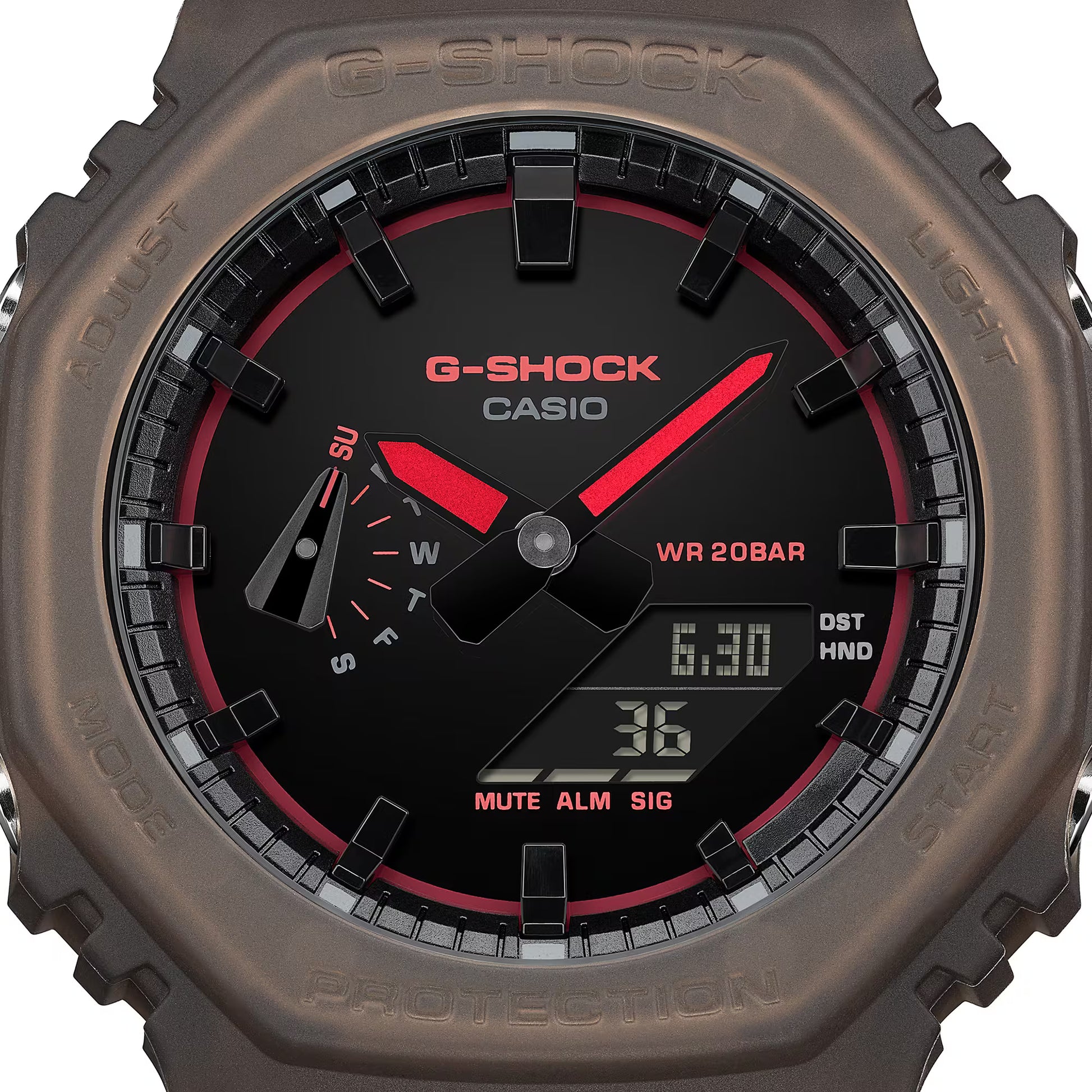 G-Shock Casio watch with brown casing and black face displaying digital and analog readings.