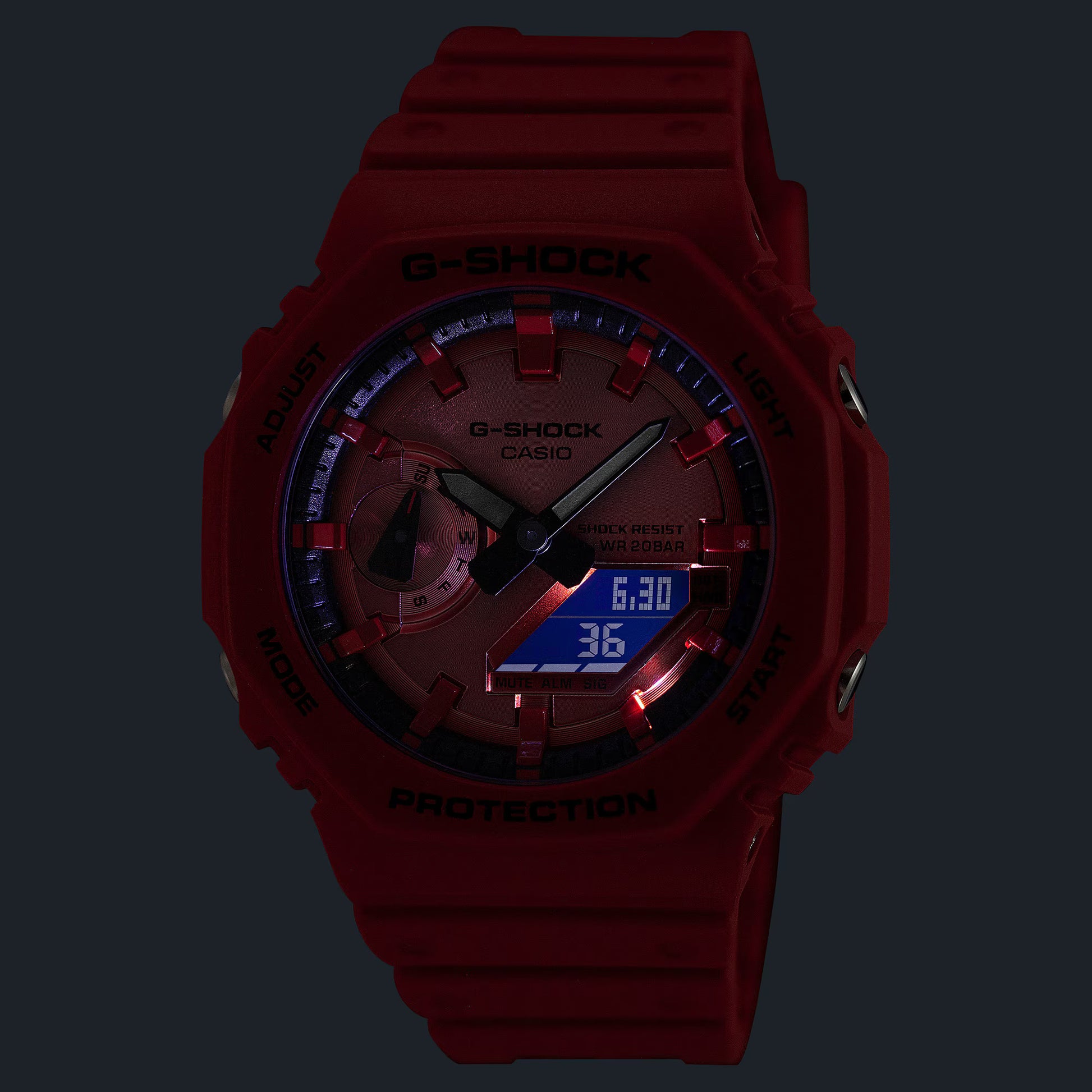 Red G-Shock watch with digital and analog display on a black background