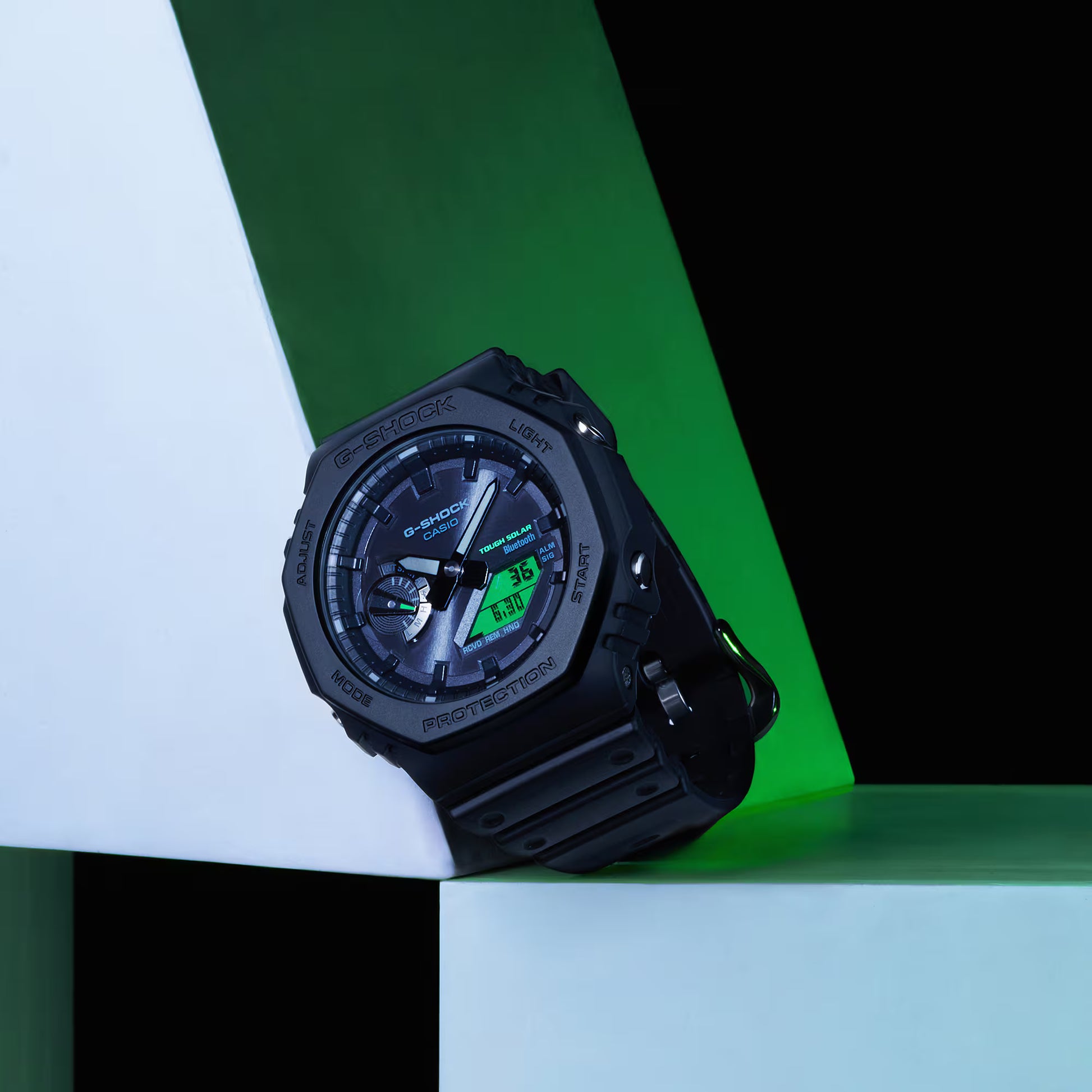 Black Casio G-Shock watch on a geometric background
