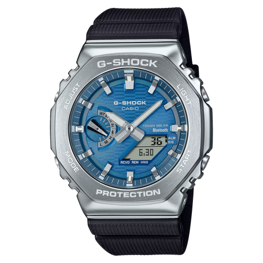 Casio G-STEEL GBM-2100A-2B men’s watch with stainless steel bezel, striking blue dial, silvery indexes, bio-based resin case and band, Tough Solar power, Bluetooth Smartphone Link, double LED Super Illuminator, shock-resistant build, and 200m water resistance.