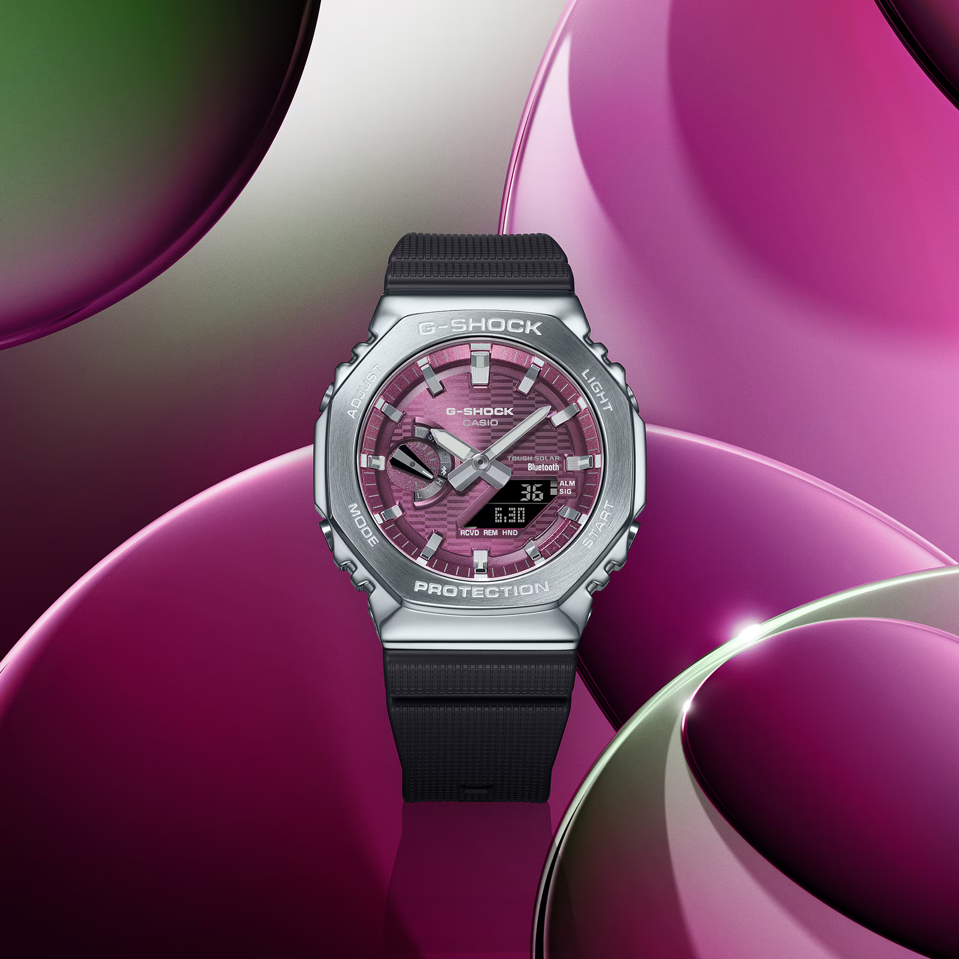G-Shock watch with pink face and black strap on a purple and white abstract background