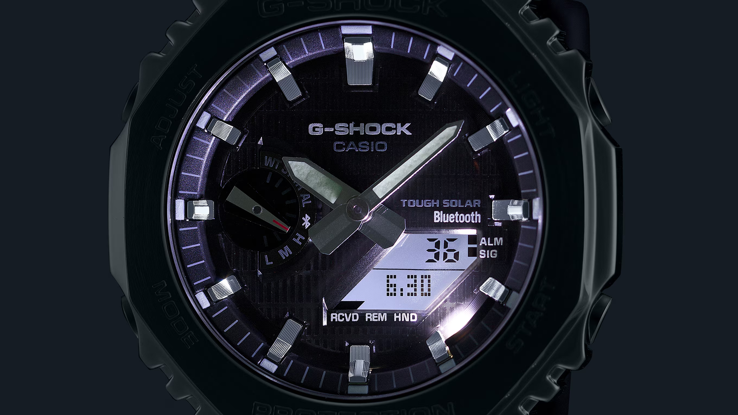 G-Shock Casio watch with black face and digital display on a dark background