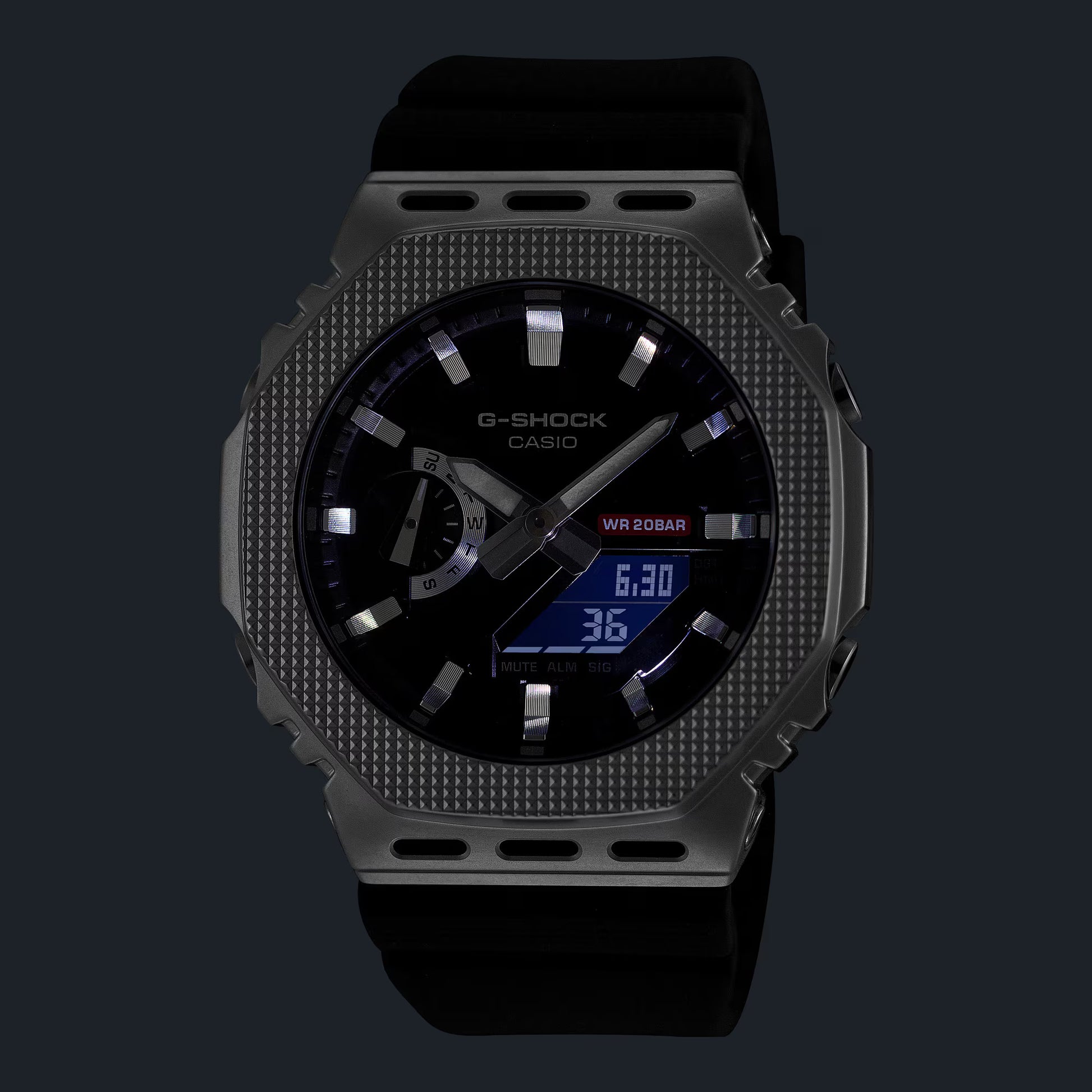 G-Shock Casio watch with black face and textured gray case on a dark background