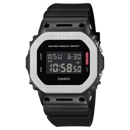 Casio G-SHOCK GM5600BM-1 with black ion-plated stainless-steel bezel, industrial textured finish, monochromatic styling, and classic square 5600 digital design.