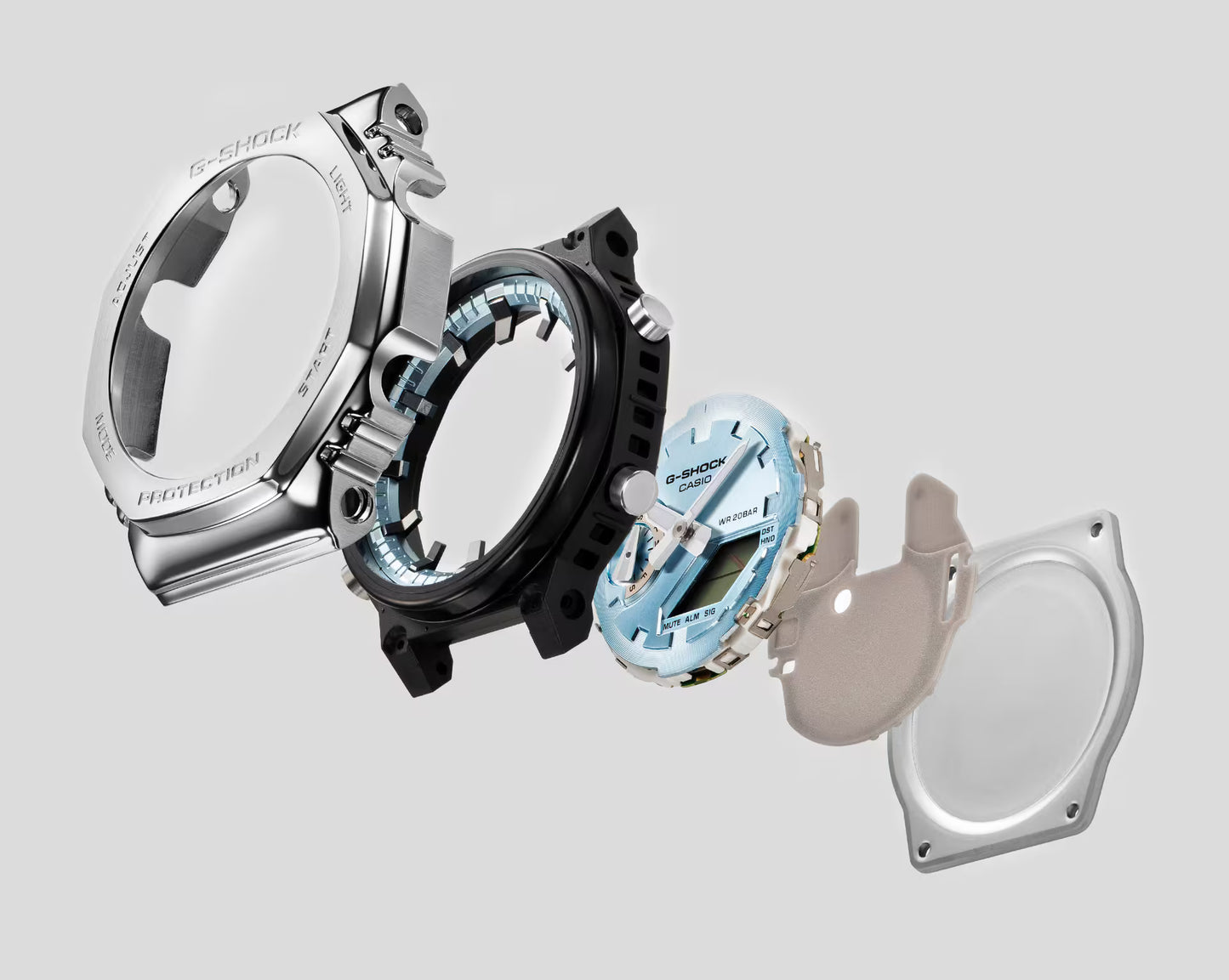 Collection of Casio G-Shock watches with different colored cases on a light gray background