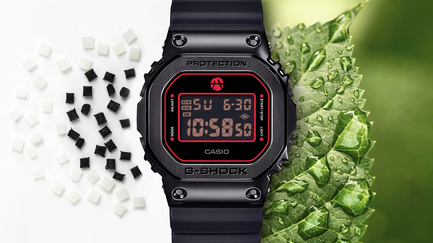 Black Casio G-Shock digital watch with red display on a green leaf background