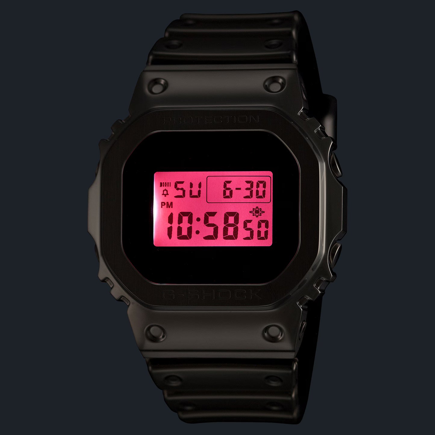 Black digital watch with pink display on a black background