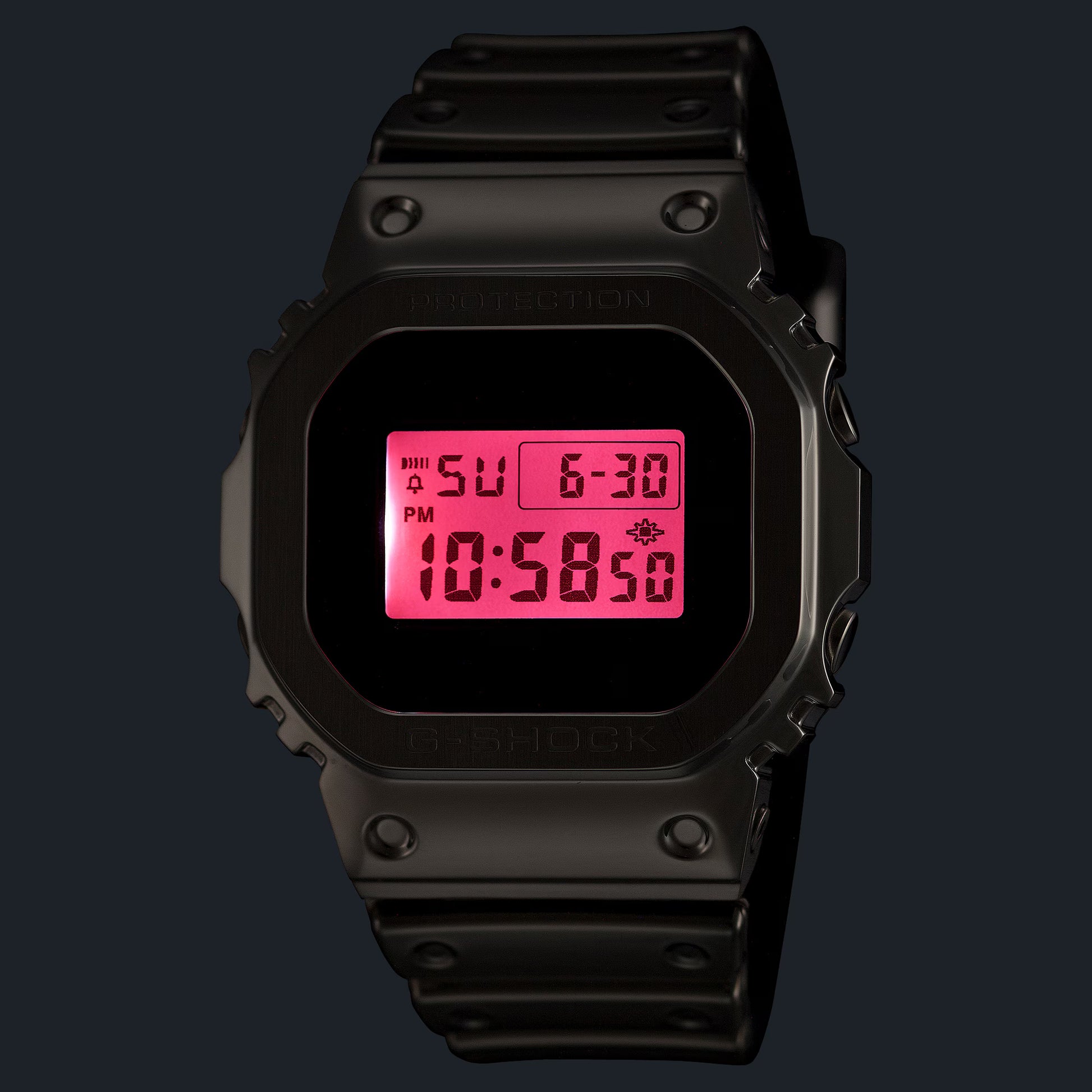 Black digital watch with pink display on a black background