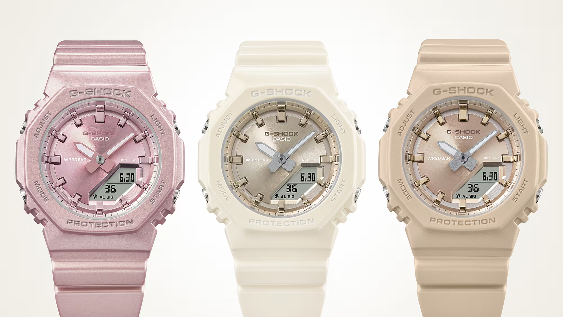 Three G-Shock watches in pink, beige, and white on a white background
