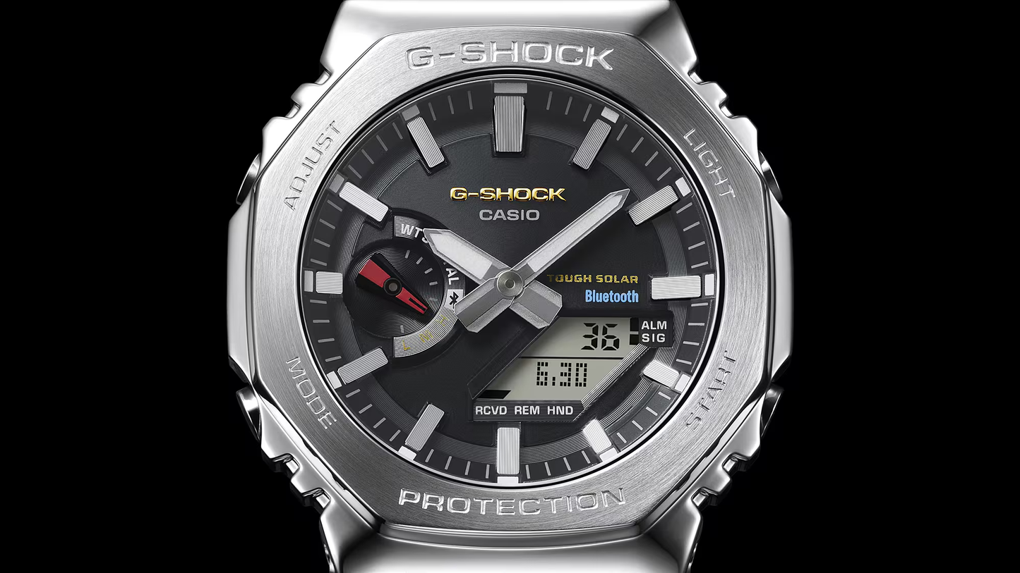 G-Shock Casio watch with silver case and black dial on a black background