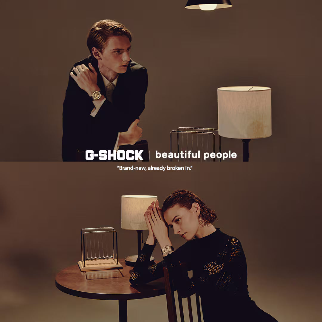 Two people sitting at a table with a G-Shock watch advertisement overlay.