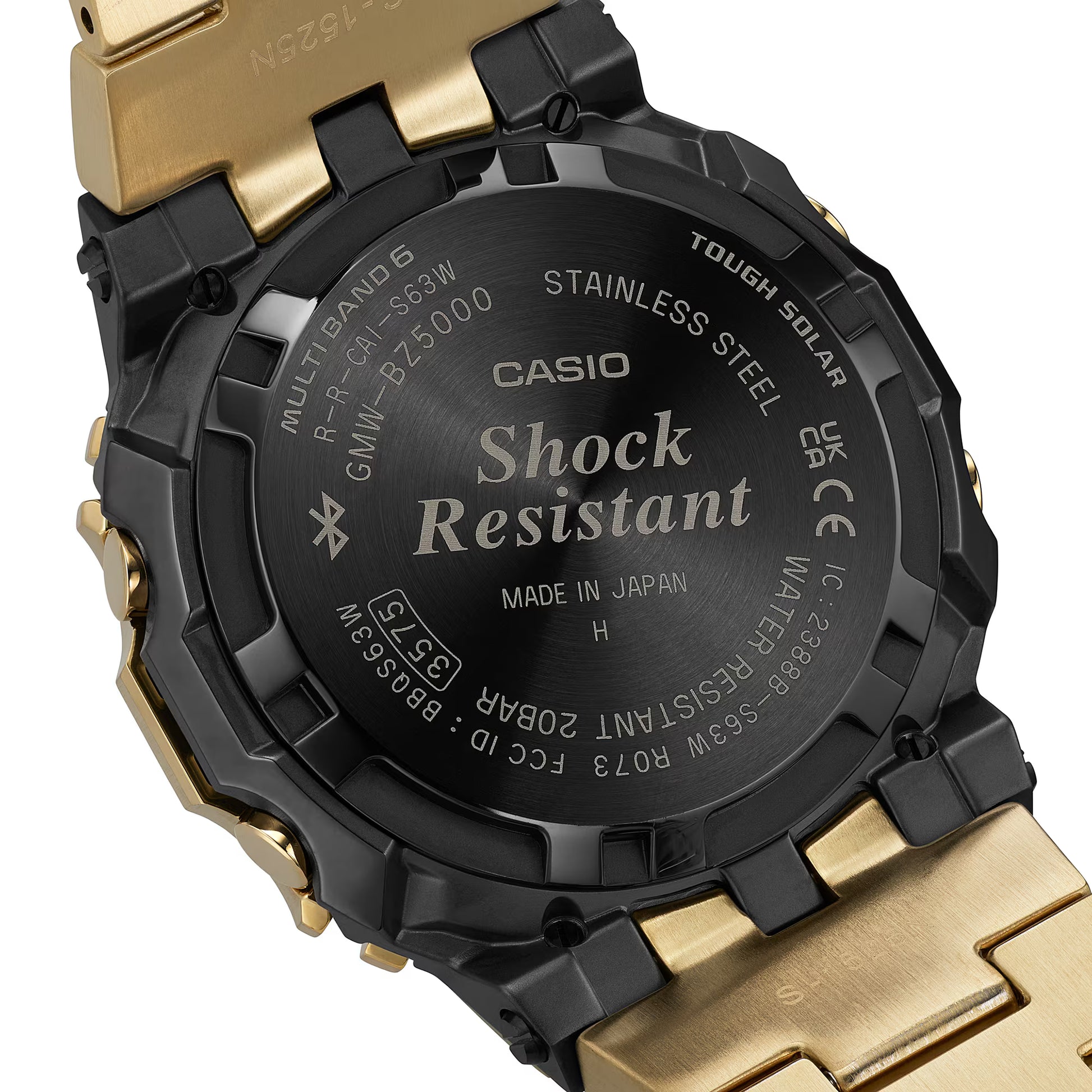Back view of a Casio watch with 'Shock Resistant' text on a gold and black casing.