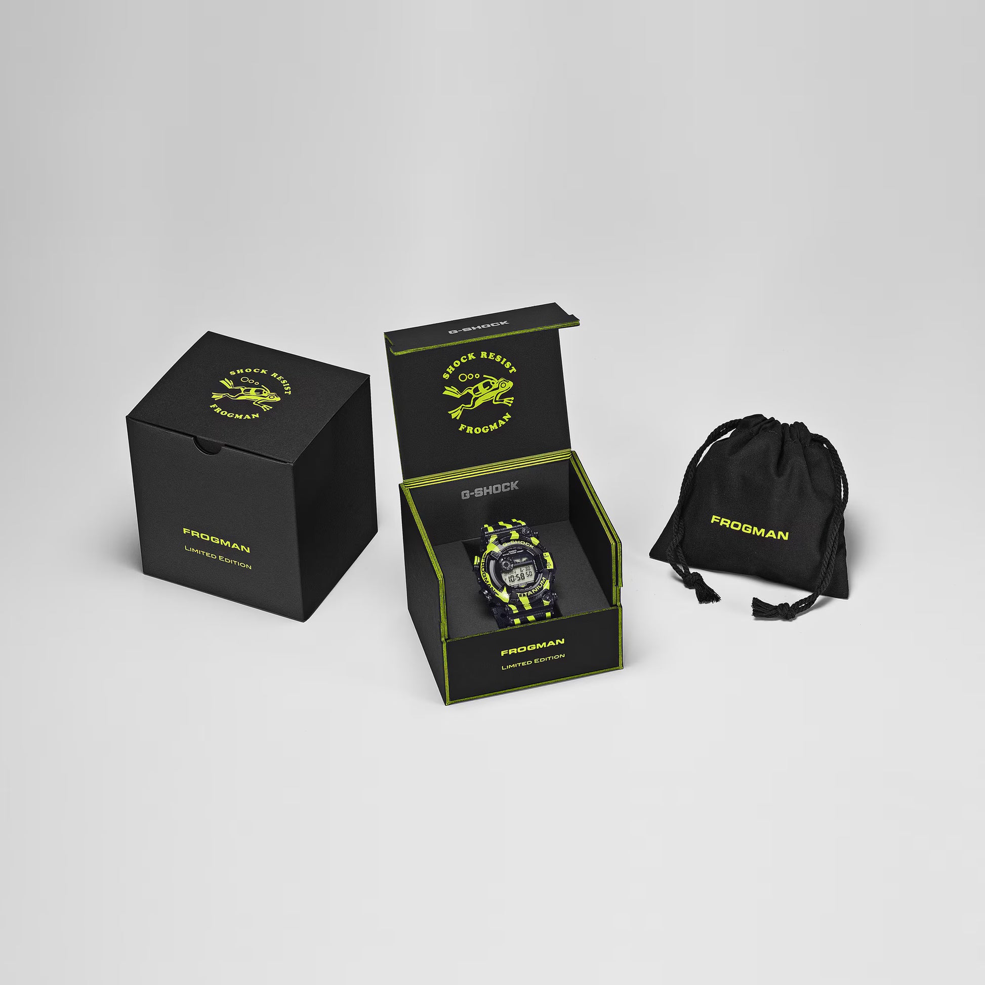 G-Shock Frogman watch with packaging and drawstring bag on a gray background