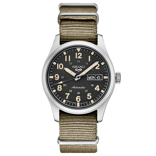 Seiko watch with black dial and beige strap on a white background