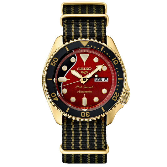 A SEIKO 5 SPORTS SRPH80 watch with a red and black dial featuring a wood-texture pattern, luminous hands and markers, and a black nylon strap with guitar string striping.