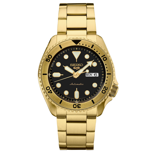 Gold Seiko watch with black dial on a white background