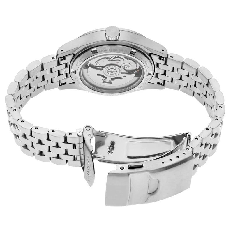 Silver stainless steel automatic watch shown from the back, featuring a multi-link bracelet, a screw crown, and a folding clasp on a white background.