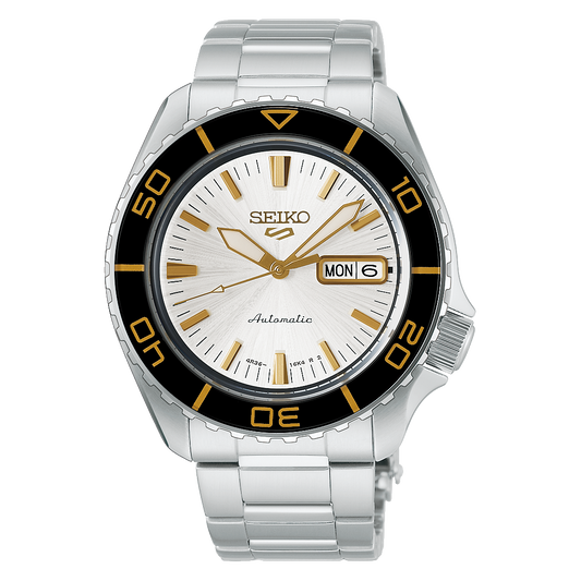 SEIKO 5 Sports HDB004 automatic watch with white dial, gold-tone markers, black rotating bezel, day-date display, and stainless steel bracelet.