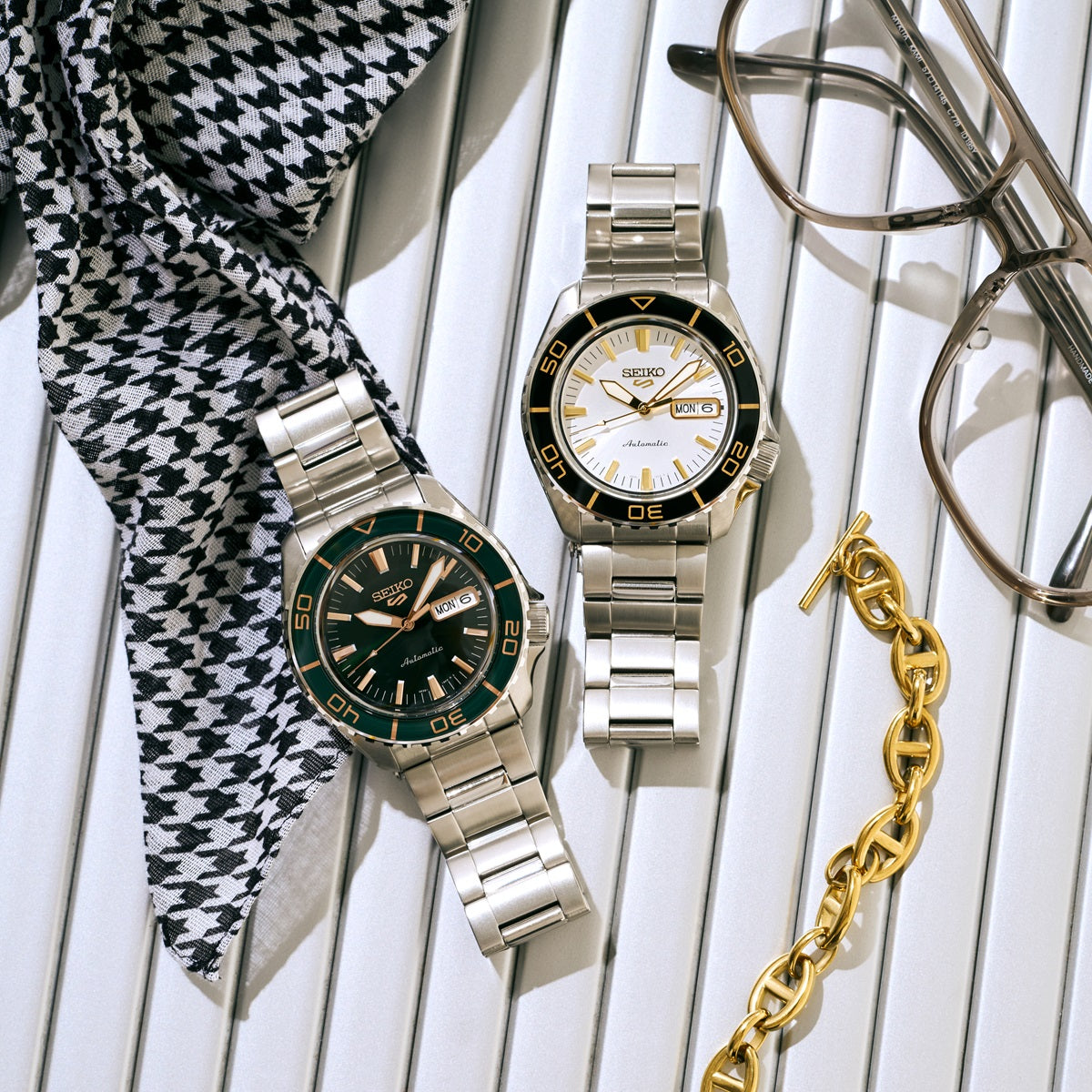 SEIKO 5 Sports HDB004 and green dial Seiko 5 Sports watches displayed with stainless steel bracelets, fashion accessories, and styled flat lay.