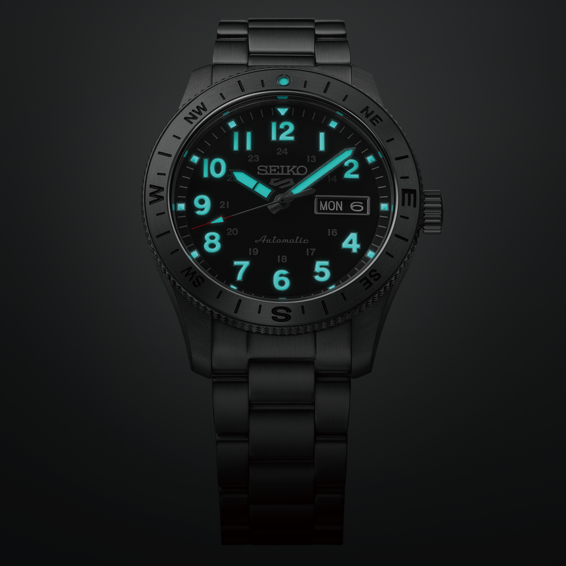Black Seiko watch with green glowing digits on a dark background