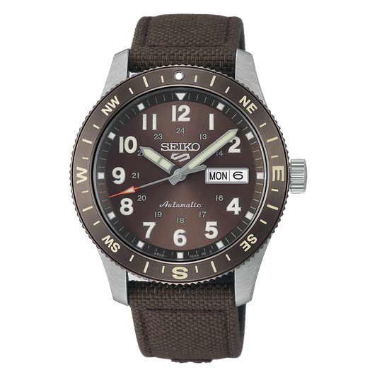 Seiko 5 Sports HDB009 Field Series automatic watch with brown earth-tone Arabic-numeral dial, 41mm stainless steel case, compass-style rotating bezel, nylon strap with leather detailing, LumiBrite details, day-date display, and Caliber 4R36 movement.