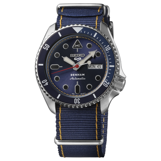 Seiko watch with blue face and strap on a white background